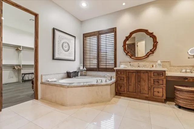 a bathroom with a granite countertop sink mirror and a