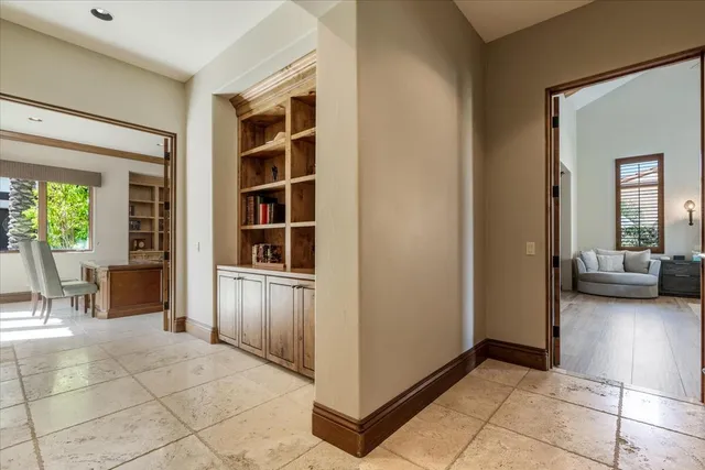 a spacious bedroom with a bed and a couch