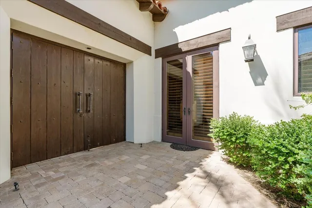 a view of a patio with a table and chairs