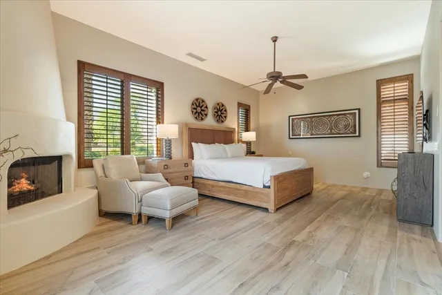 a view of a house with backyard porch and sitting area