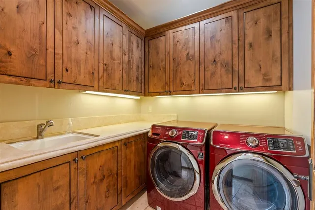 an aerial view of a house with a garden and swimming pool