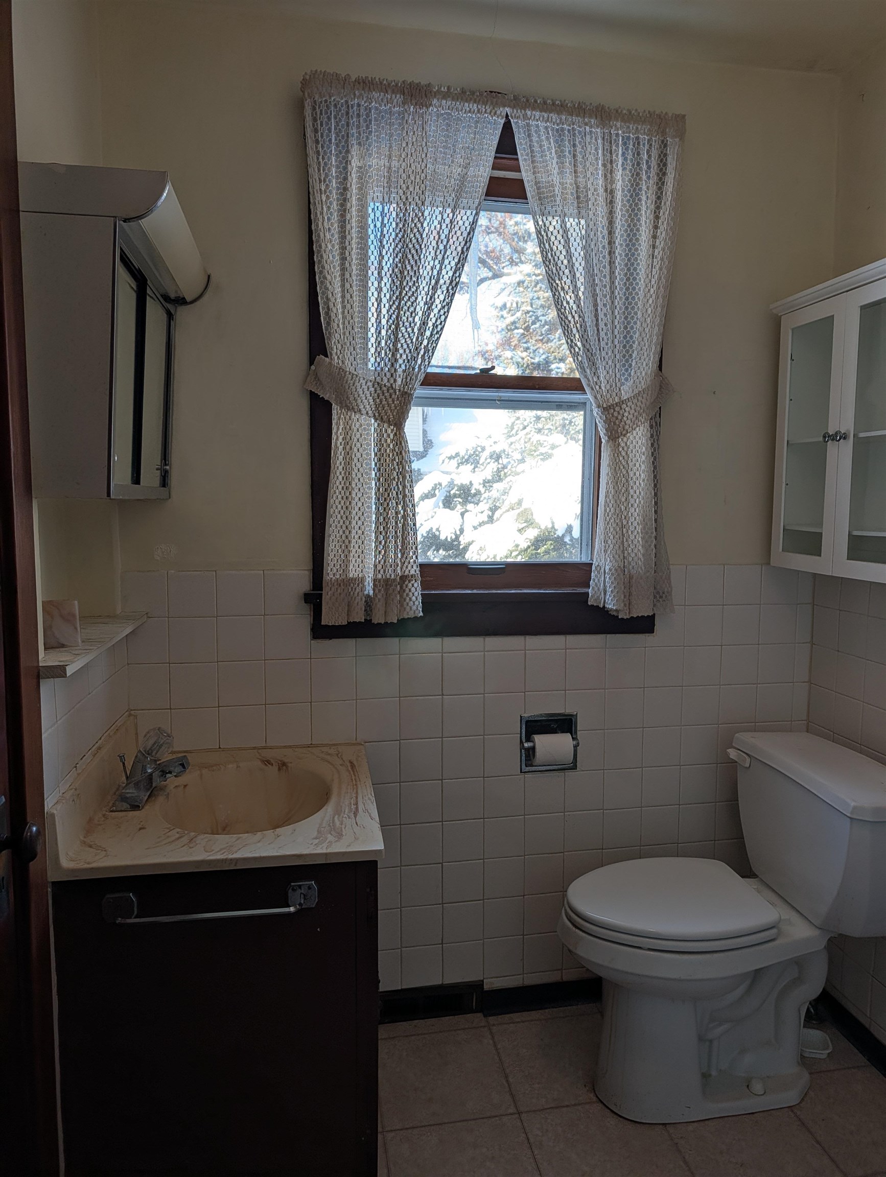 321 Eureka Street Genoa, IL 60135 - Photo 8 of 15 a bathroom with a toilet sink and mirror