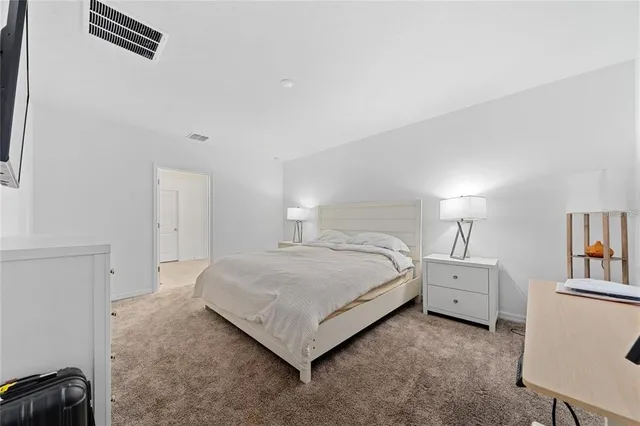 a bedroom with a bed and a cabinets