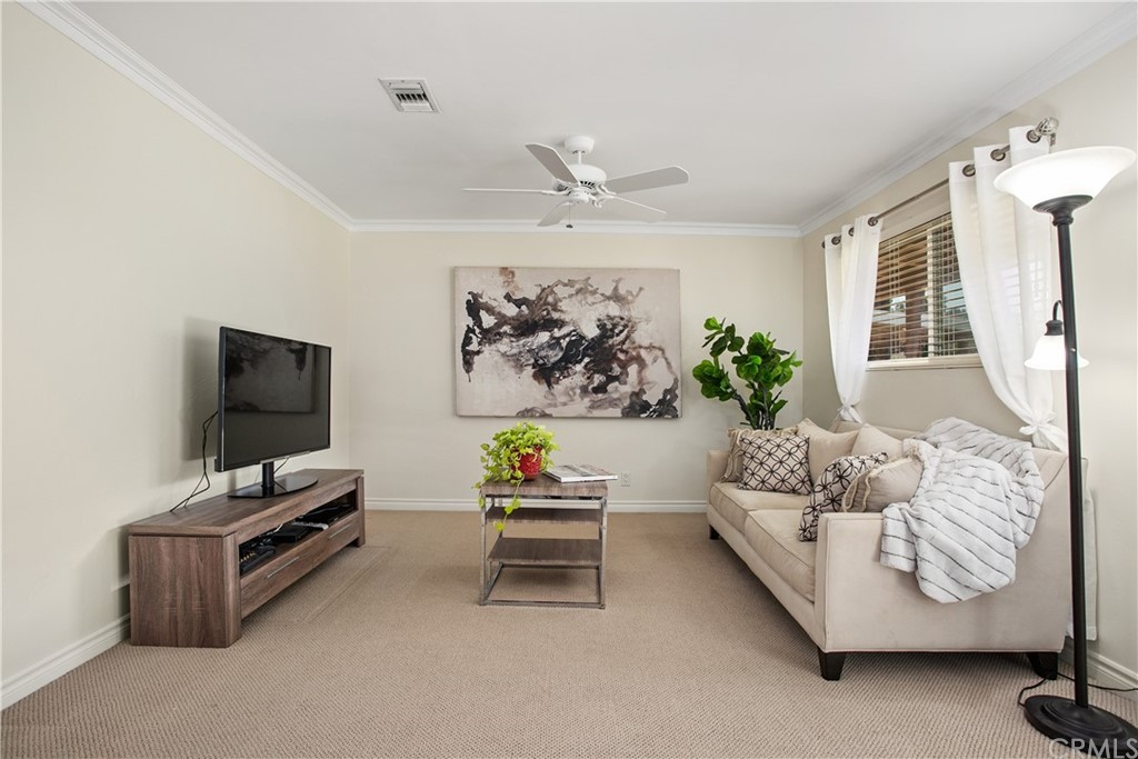 13019 Adah Lane Poway, CA 92064 - Photo 11 of 34 a living room with furniture and a flat screen tv