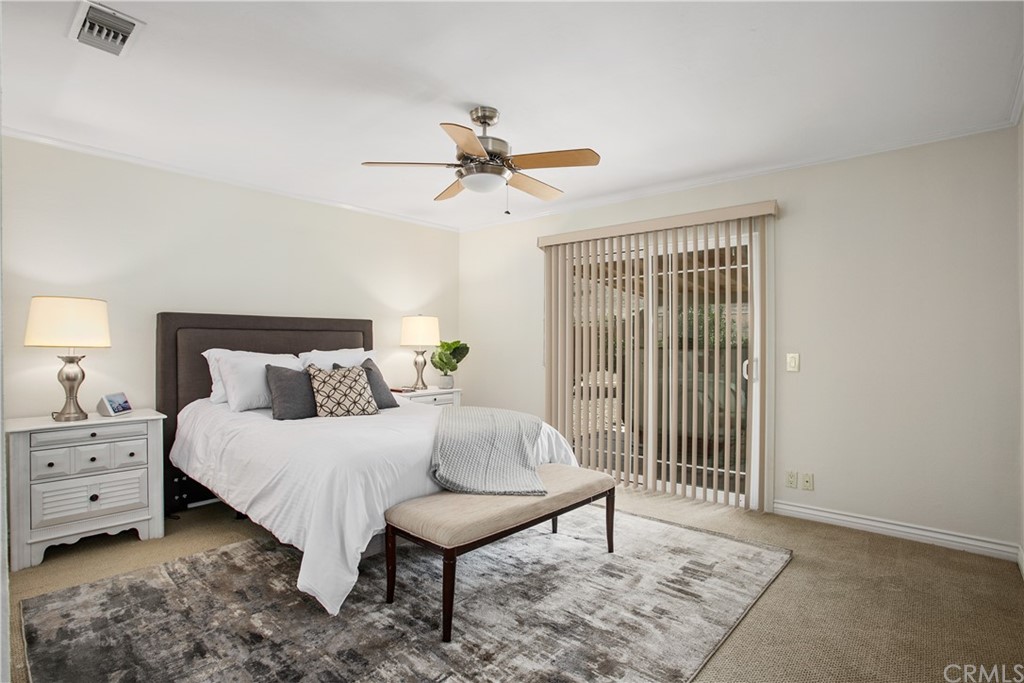 13019 Adah Lane Poway, CA 92064 - Photo 16 of 34 a bedroom with a bed and a chandelier