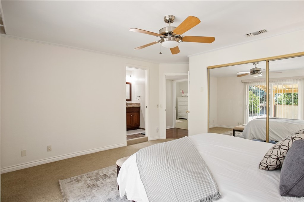 13019 Adah Lane Poway, CA 92064 - Photo 18 of 34 a bedroom with a bed and a large mirror