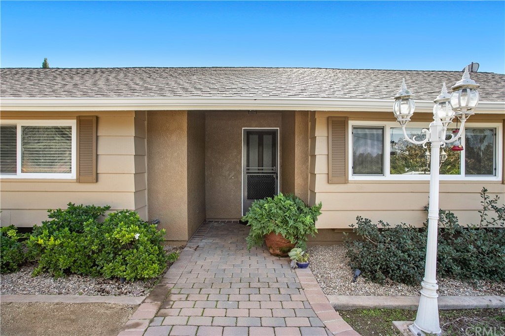 13019 Adah Lane Poway, CA 92064 - Photo 4 of 34 a front view of a house with a yard