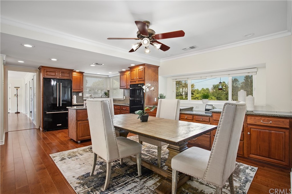 13019 Adah Lane Poway, CA 92064 - Photo 7 of 34 a dining room with furniture a window and a chandelier