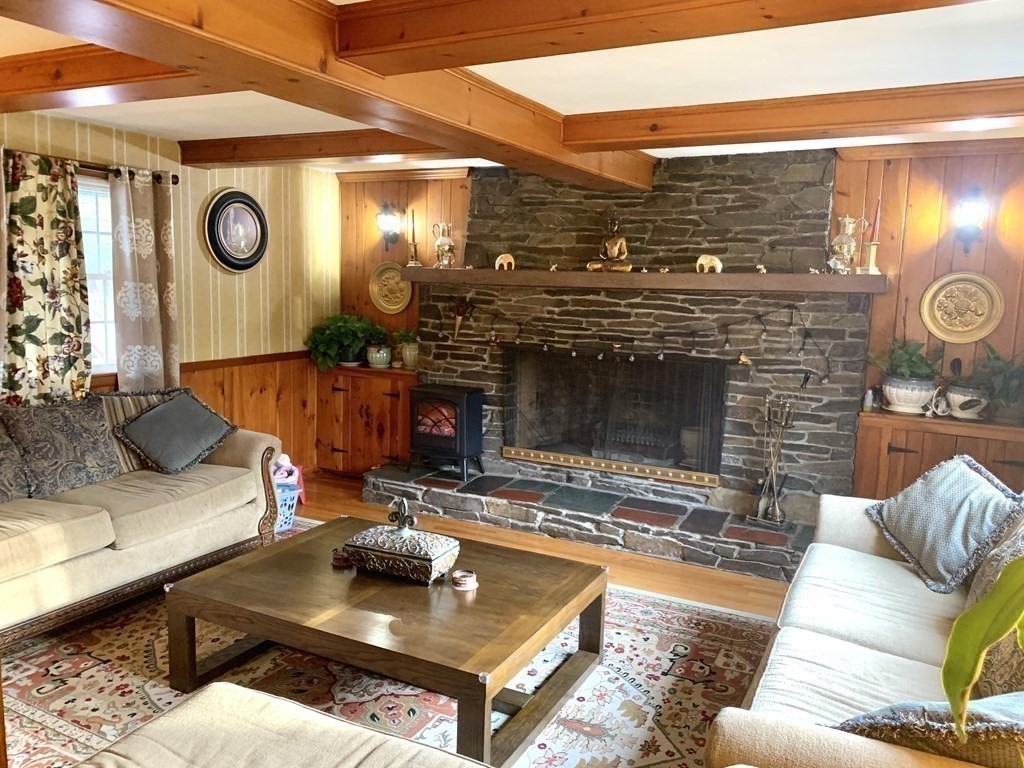412 Plain Road Greenfield, MA 01301 - Photo 6 of 37 a living room with furniture and a fireplace