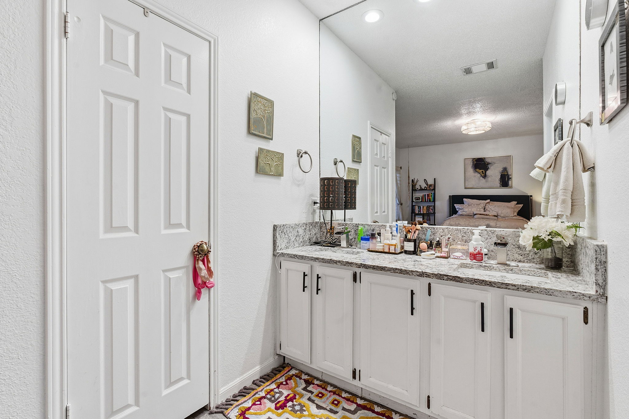 10819 Crown Colony Drive, Unit 33 Austin, TX 78747 - Photo 22 of 27 a kitchen with white cabinets and sink