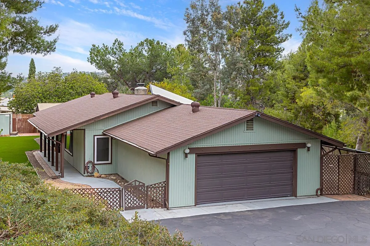 12759 Claire Drive Poway, CA 92064 - Photo 2 of 40 a house that has a tree in front of it