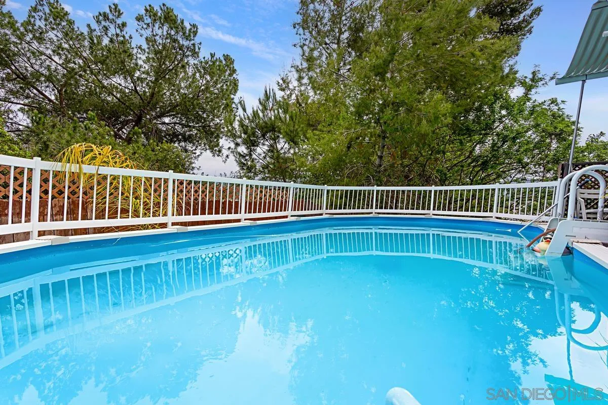 12759 Claire Drive Poway, CA 92064 - Photo 35 of 40 a view of a swimming pool with a deck