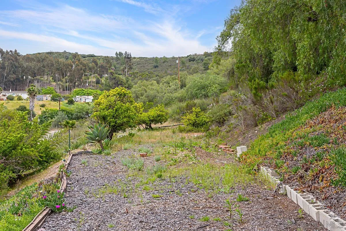 12759 Claire Drive Poway, CA 92064 - Photo 40 of 40 a view of a yard with a mountain