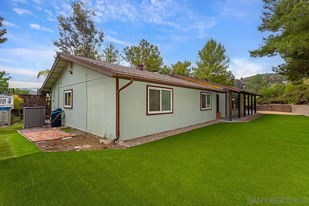 12759 Claire Drive Poway, CA 92064 - Photo 5 of 40 a view of backyard with barbeque grill potted plants and large tree