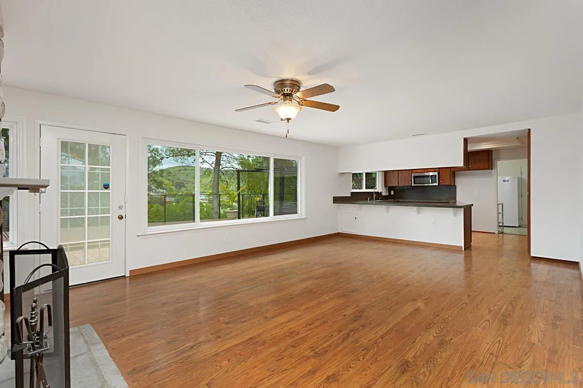 12759 Claire Drive Poway, CA 92064 - Photo 8 of 40 a view of a kitchen with microwave and furniture