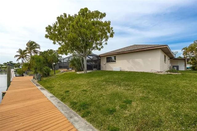 a view of a lake with a table and chairs