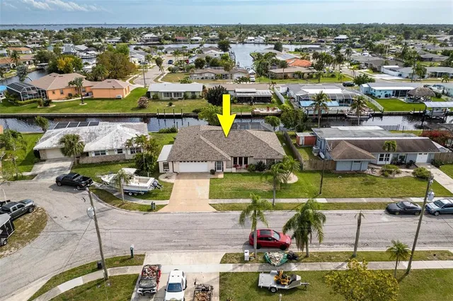 an aerial view of residential houses with outdoor space