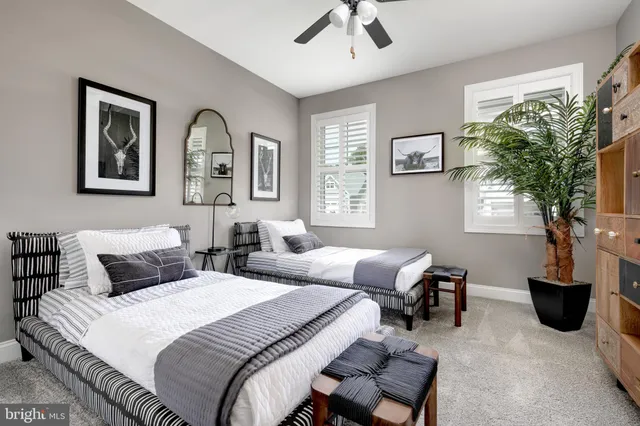 a bedroom with furniture and a window