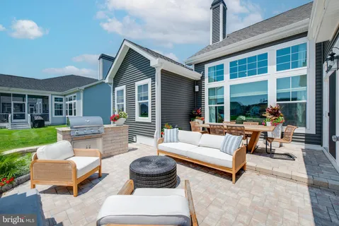 a outdoor living space with patio furniture and garden