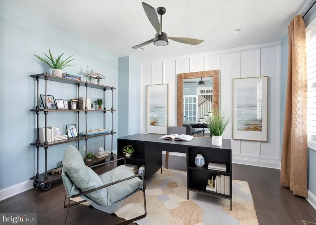 a room with a table chairs and wooden floor