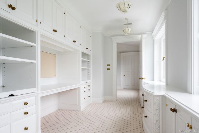 a bathroom with a bathtub sink and mirror
