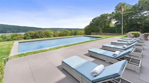 a view of swimming pool with lounge chair