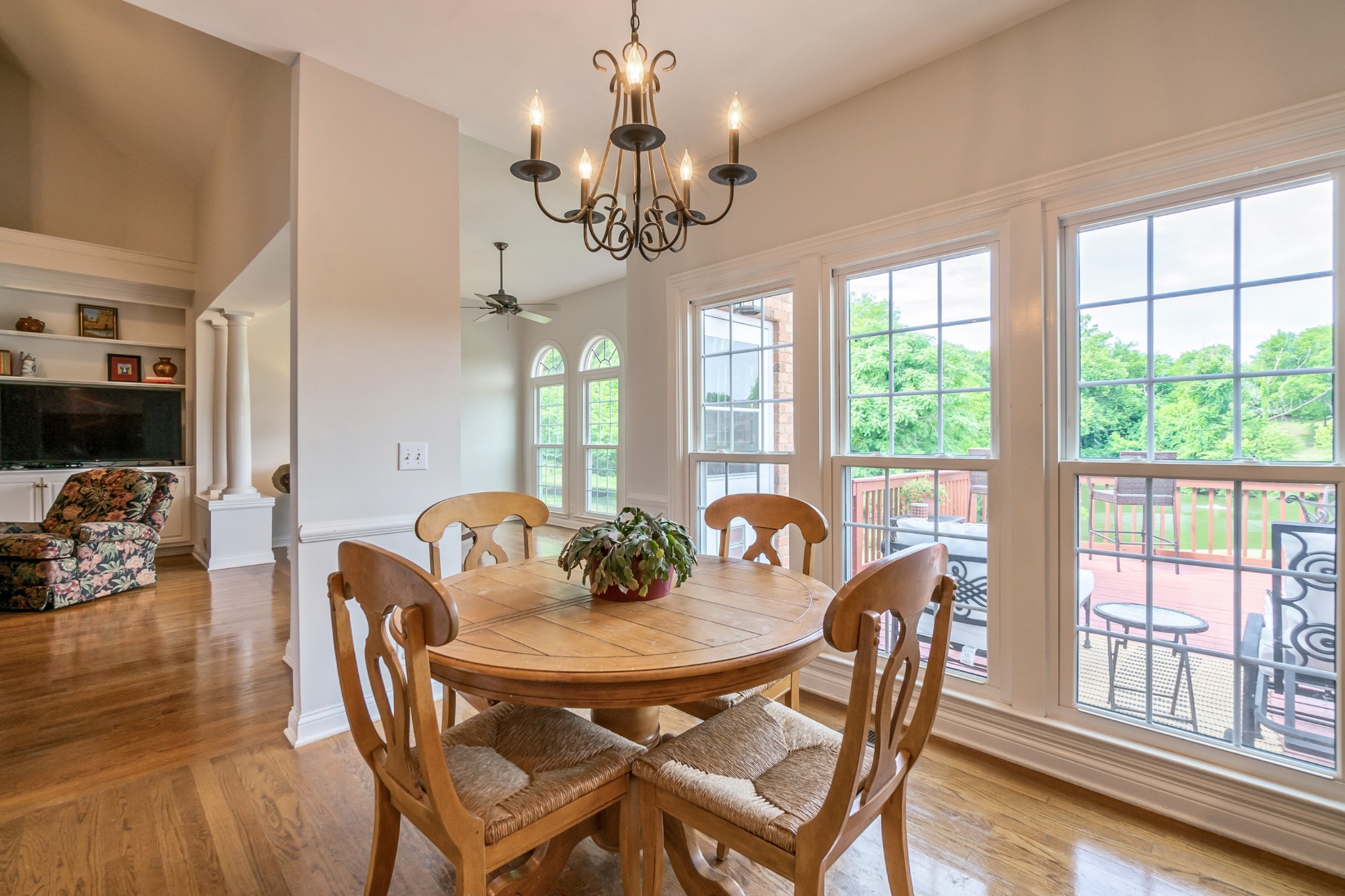 413 Doe Ridge Franklin, TN 37067 - Photo 11 of 42 a view of a dining room with furniture a chandelier and large windows