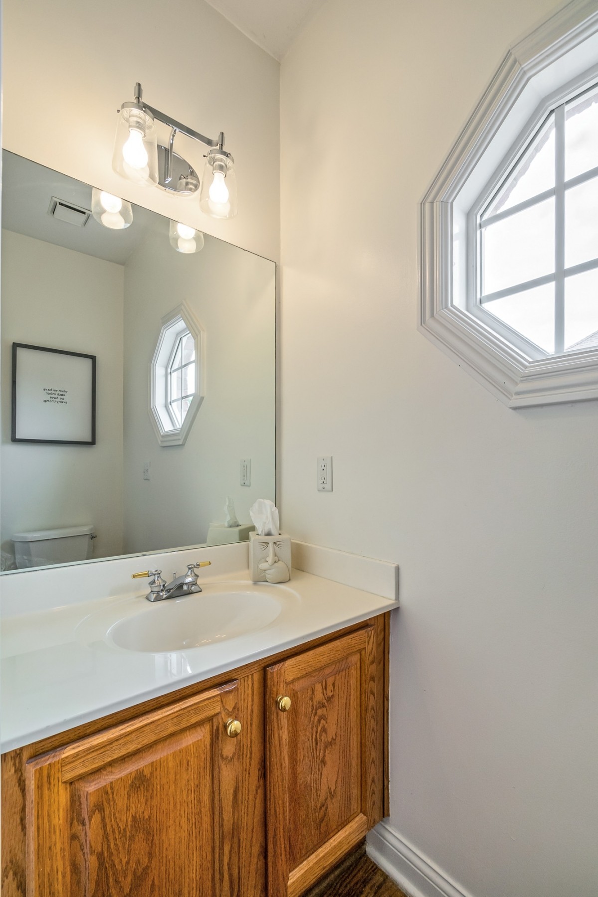 413 Doe Ridge Franklin, TN 37067 - Photo 17 of 42 a bathroom with a sink a mirror and a window