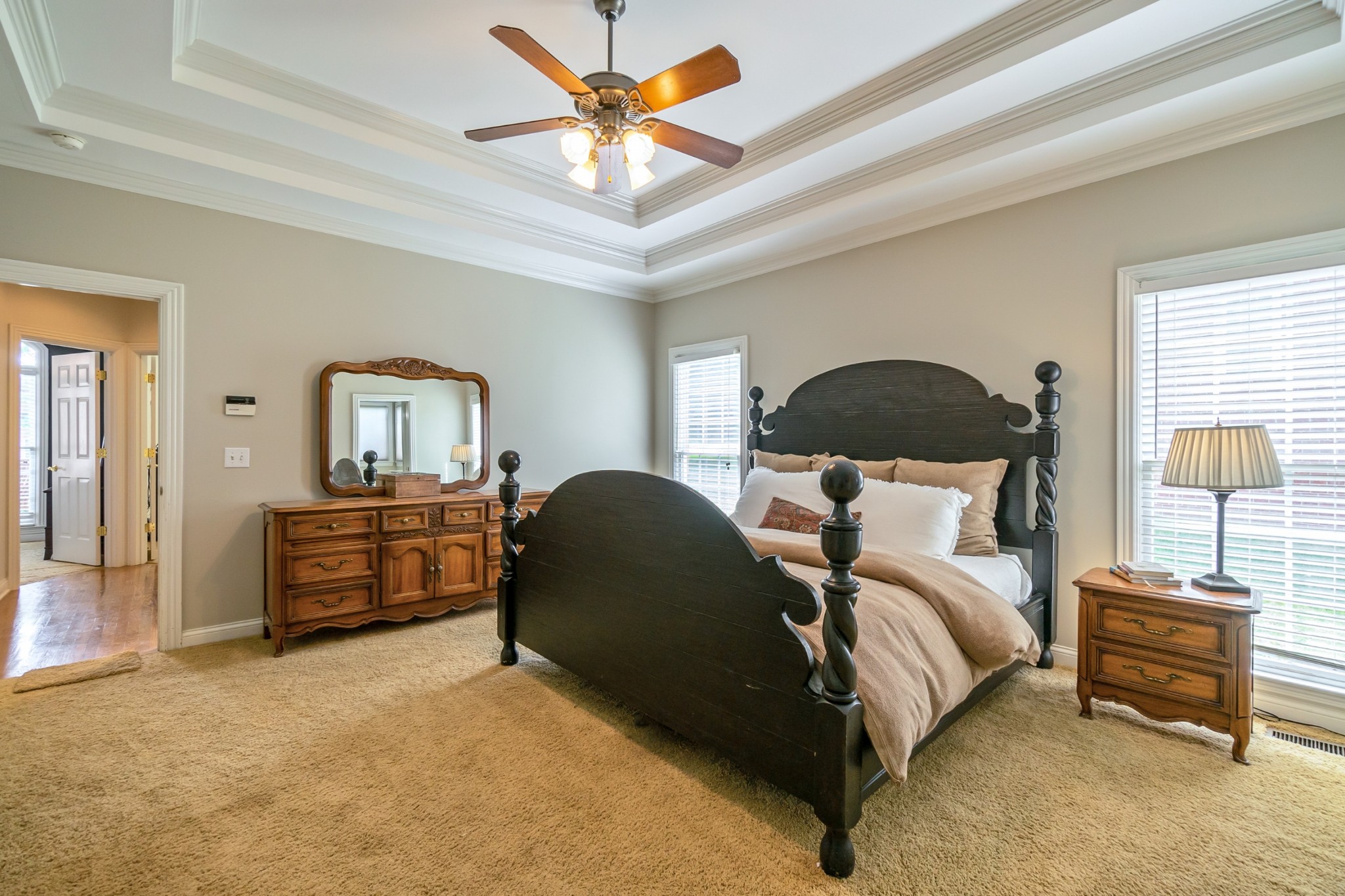 413 Doe Ridge Franklin, TN 37067 - Photo 18 of 42 a bedroom with a bed and a chandelier