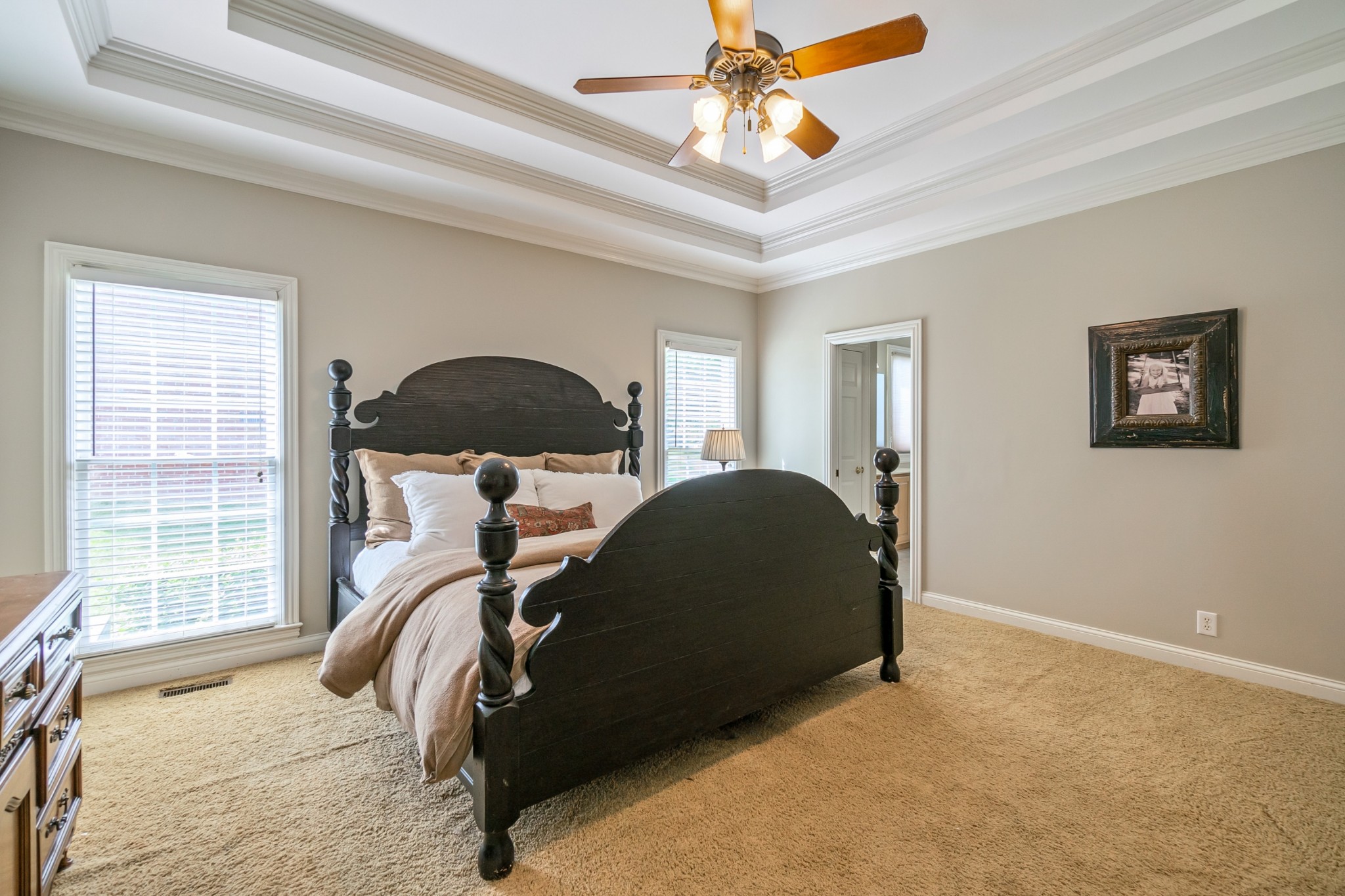 413 Doe Ridge Franklin, TN 37067 - Photo 19 of 42 a bedroom with a bed and a chandelier