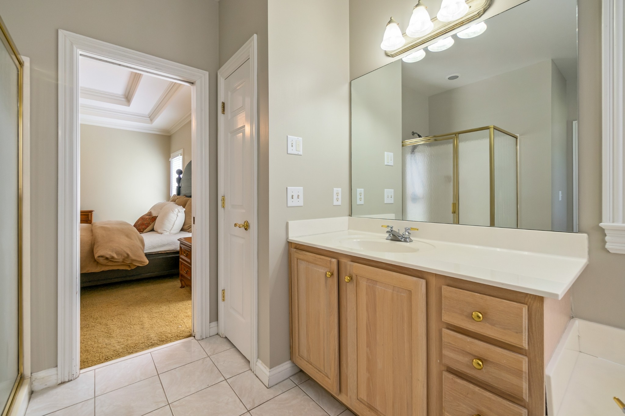 413 Doe Ridge Franklin, TN 37067 - Photo 21 of 42 a en suite bathroom with a granite countertop sink and a mirror