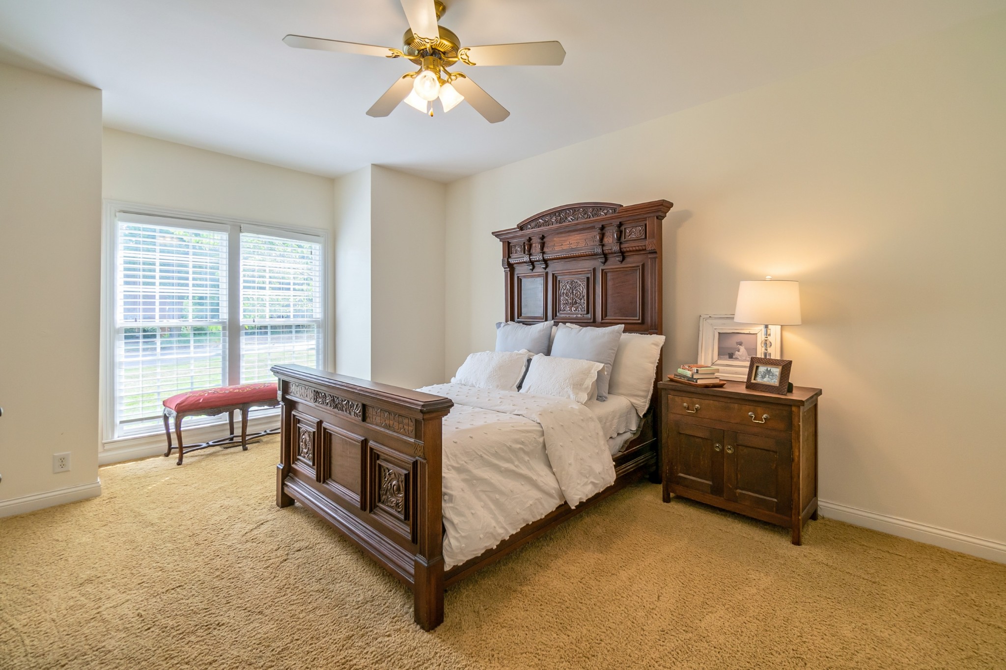 413 Doe Ridge Franklin, TN 37067 - Photo 24 of 42 a spacious bedroom with a bed and a chandelier