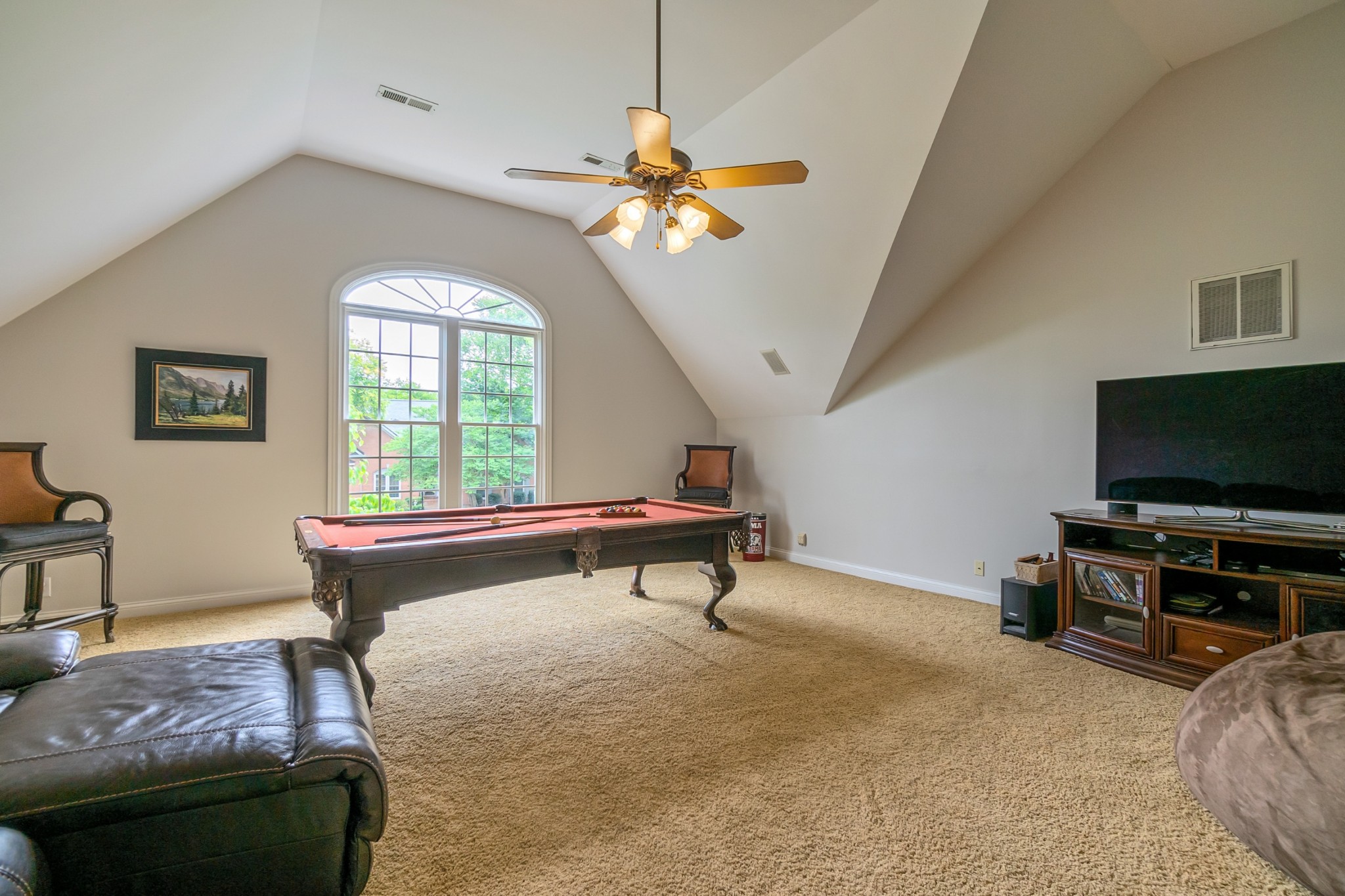 413 Doe Ridge Franklin, TN 37067 - Photo 27 of 42 a living room with furniture a flat screen tv and a window