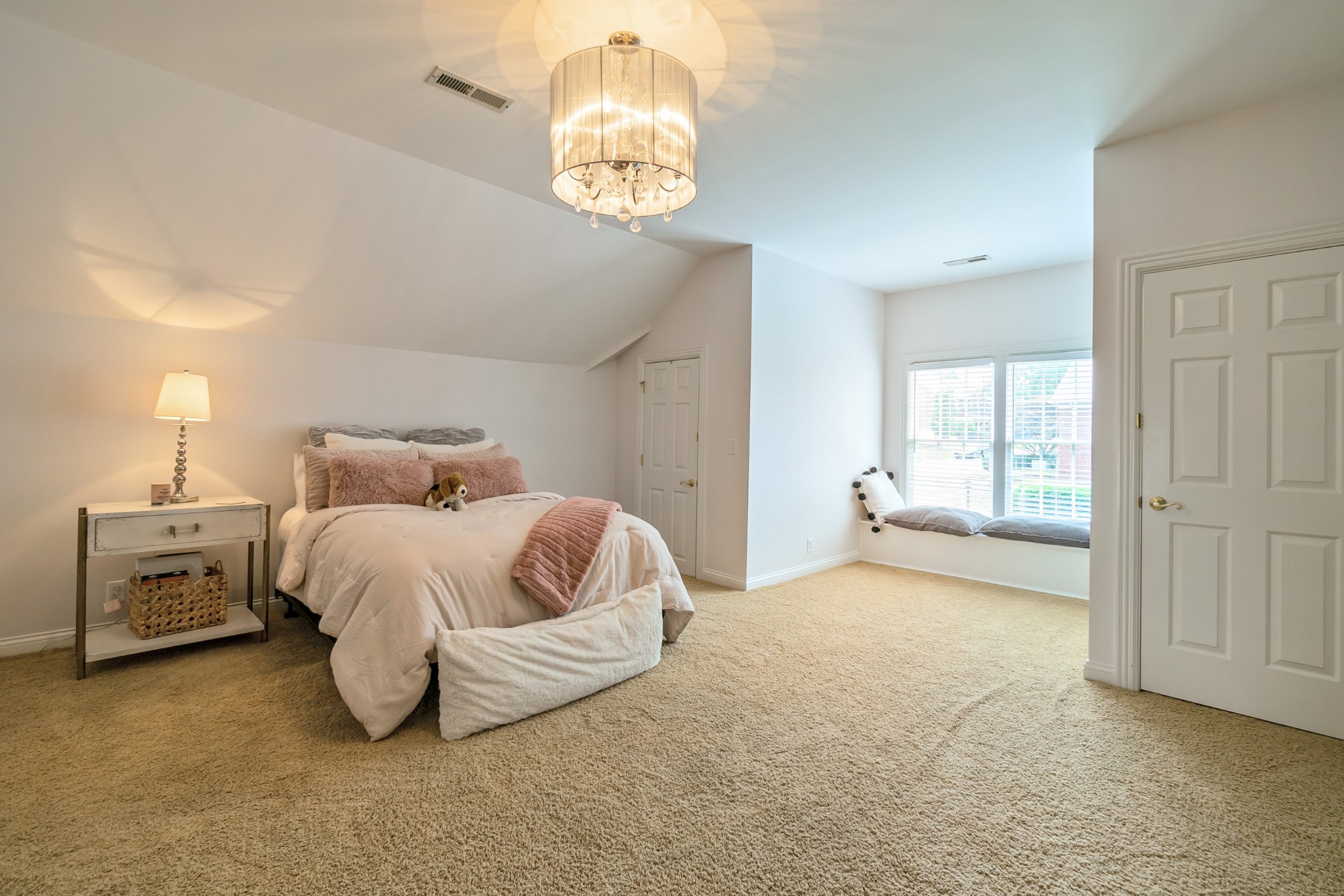 413 Doe Ridge Franklin, TN 37067 - Photo 34 of 42 a spacious bedroom with a bed and a chandelier