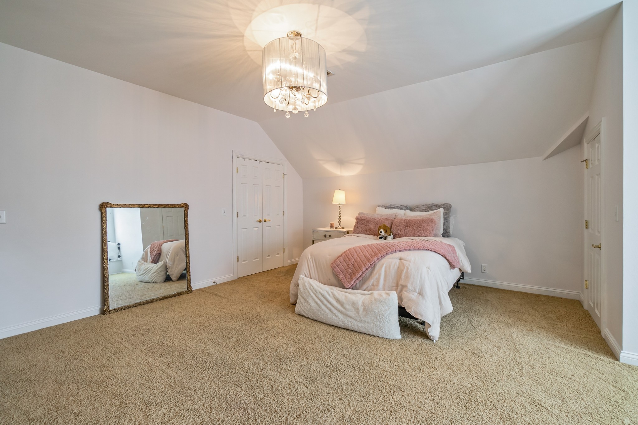 413 Doe Ridge Franklin, TN 37067 - Photo 35 of 42 a spacious bedroom with a bed and a chandelier