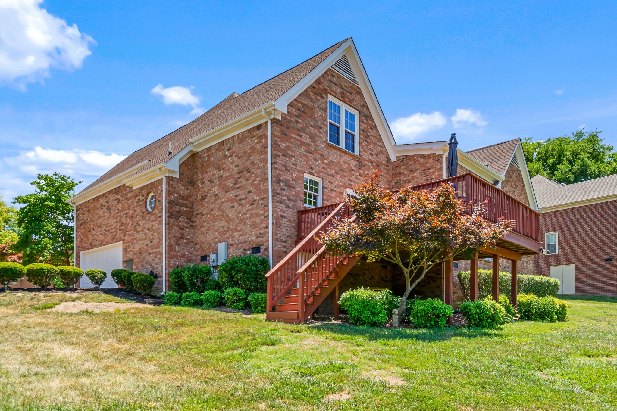 413 Doe Ridge Franklin, TN 37067 - Photo 39 of 42 a front view of house with yard and green space