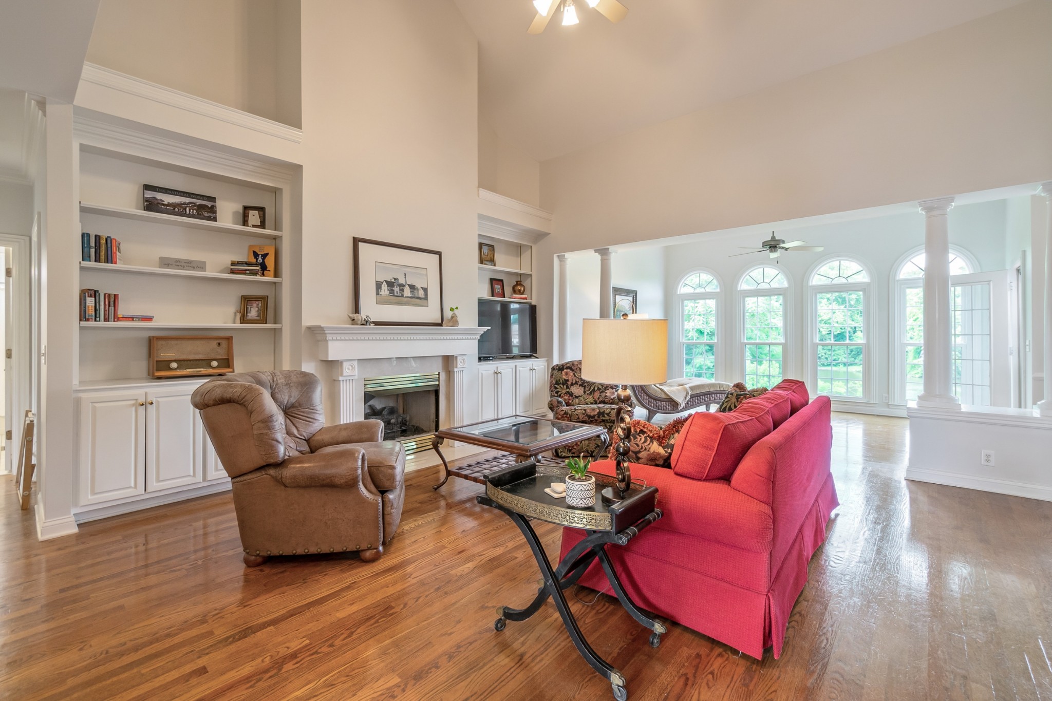 413 Doe Ridge Franklin, TN 37067 - Photo 6 of 42 a living room with furniture a fireplace and wooden floor
