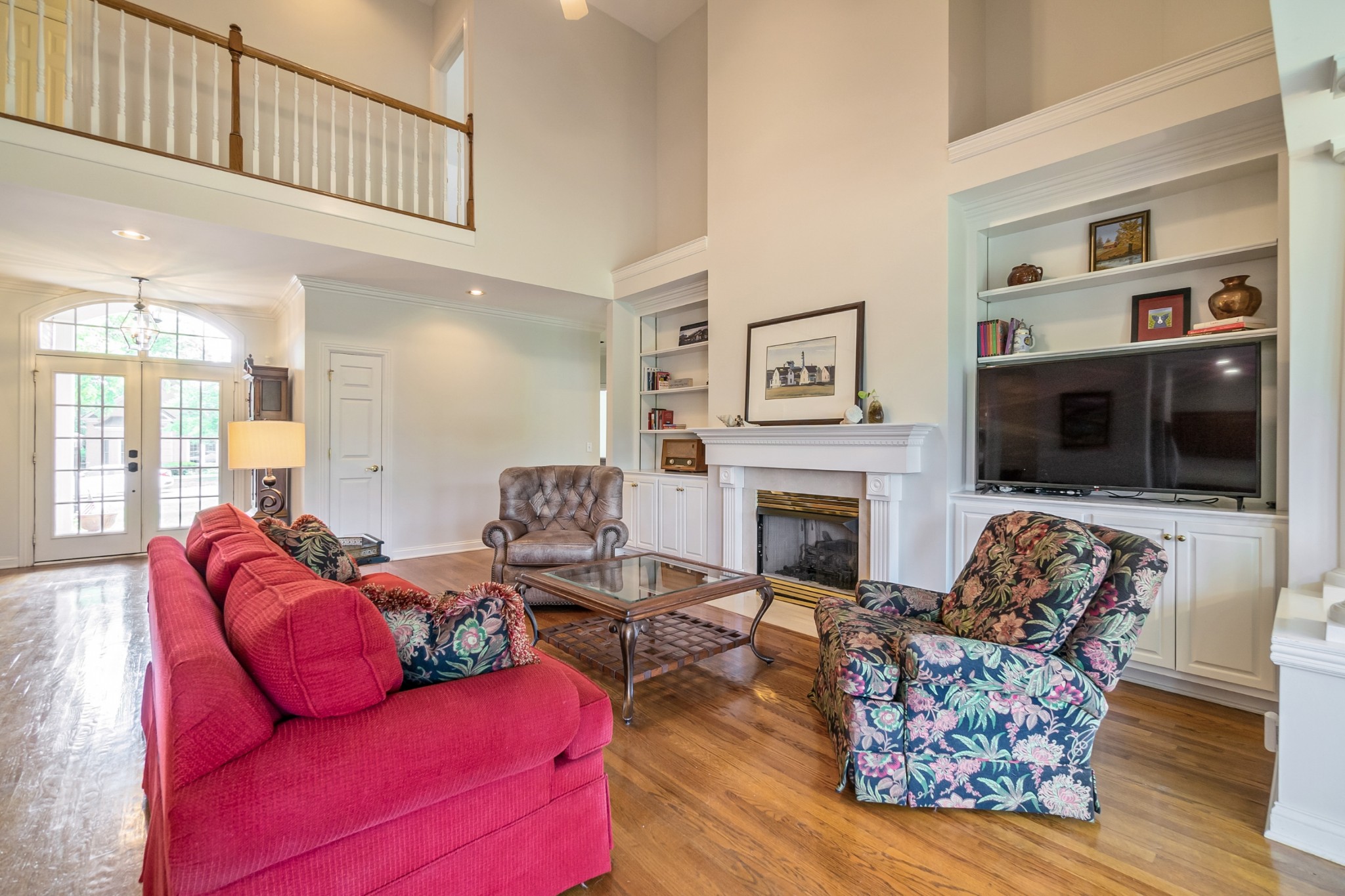 413 Doe Ridge Franklin, TN 37067 - Photo 7 of 42 a living room with furniture or flat screen tv and a fireplace