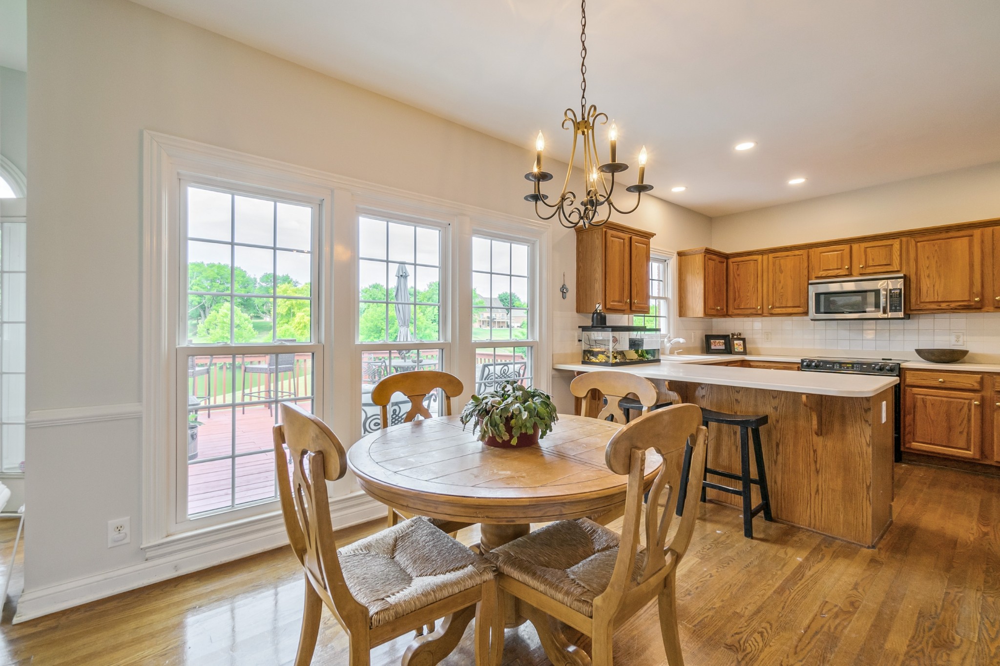 413 Doe Ridge Franklin, TN 37067 - Photo 10 of 42 a view of a dining room with furniture window and wooden floor