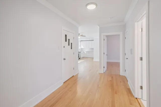 a view of a bathroom with wooden floor