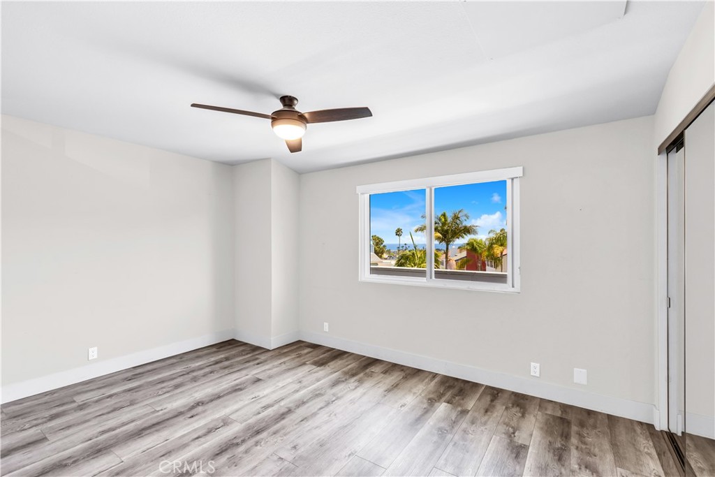 24502 Selva Road, Unit A2 Dana Point, CA 92629 - Photo 15 of 23 a view of empty room with wooden floor