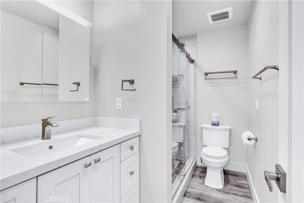 24502 Selva Road, Unit A2 Dana Point, CA 92629 - Photo 17 of 23 a bathroom with a sink toilet and shower