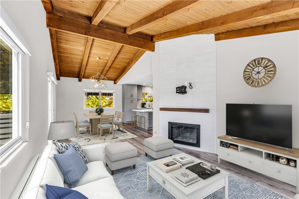 24502 Selva Road, Unit A2 Dana Point, CA 92629 - Photo 4 of 23 a living room with furniture and a flat screen tv