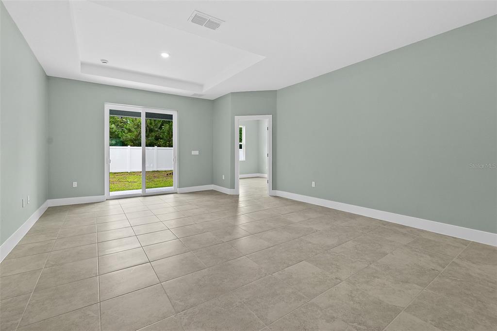 13 Karas Trail Palm Coast, FL 32164 - Photo 18 of 37 a view of an empty room with a window
