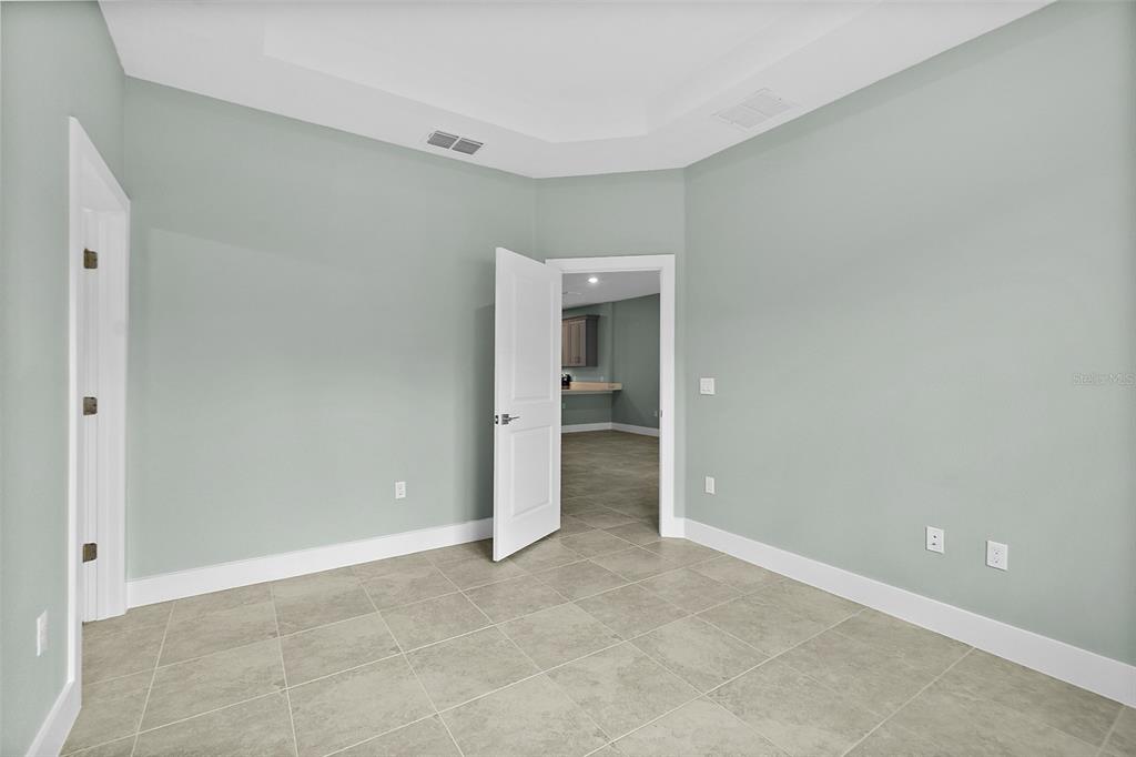 13 Karas Trail Palm Coast, FL 32164 - Photo 21 of 37 an empty room with an entrance to other room