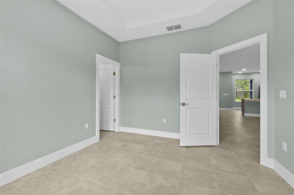 13 Karas Trail Palm Coast, FL 32164 - Photo 22 of 37 an empty room with mirror in it