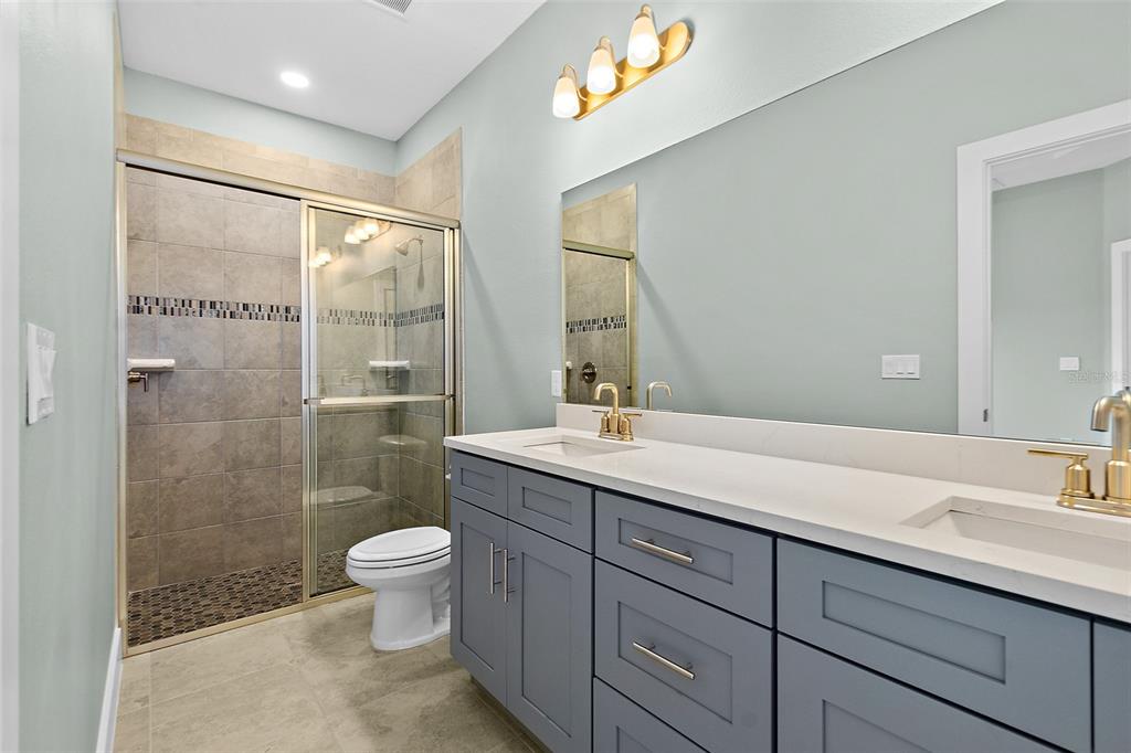 13 Karas Trail Palm Coast, FL 32164 - Photo 23 of 37 a bathroom with a sink toilet and shower