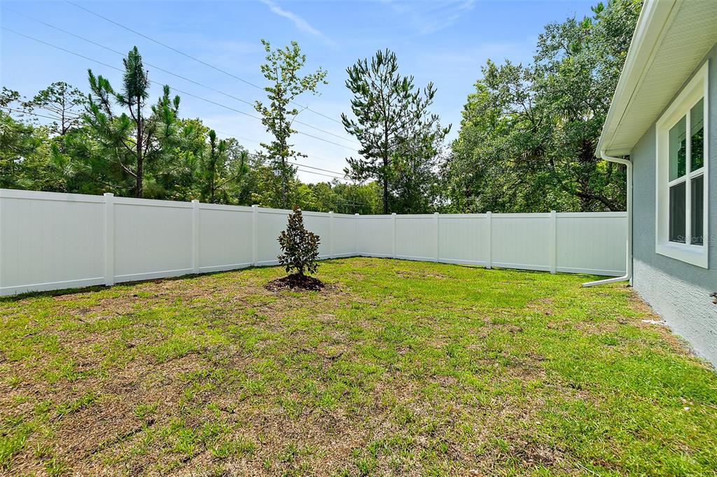 13 Karas Trail Palm Coast, FL 32164 - Photo 34 of 37 a view of a swimming pool with an outdoor space
