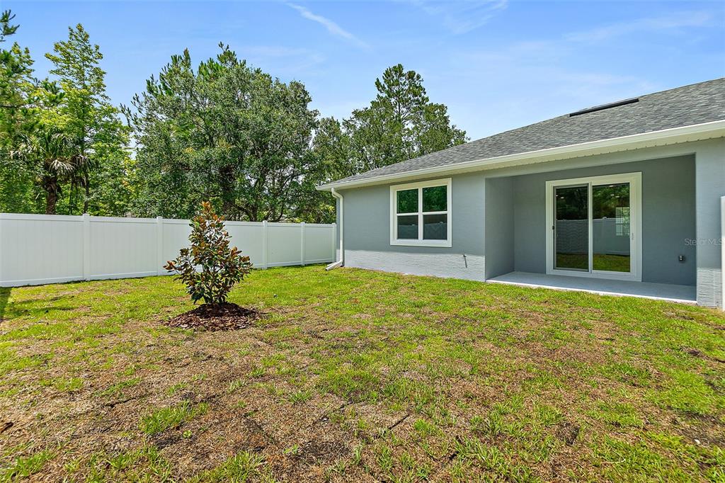 13 Karas Trail Palm Coast, FL 32164 - Photo 35 of 37 a view of a house with a backyard