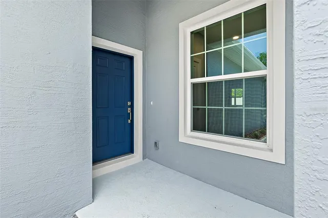 a kitchen with stainless steel appliances granite countertop a stove top oven a sink a refrigerator and a granite counter tops